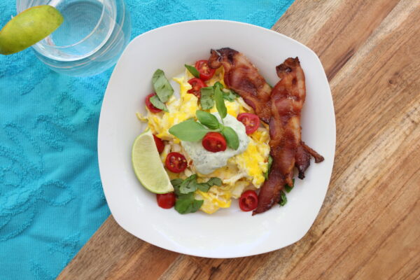 Basil and Tomato Eggs Scramble with Creamy Basil Sauce and Bacon